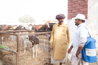 re_Farmer with extension worker at his farm
